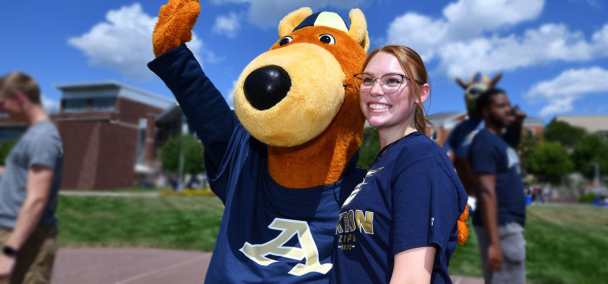 A transfer student with Zippy at ʿ hanging out on campus.